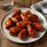 Comida a domicilio - Alitas de pollo fritas con salsa barbacoa